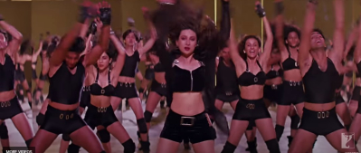 In song LE GAYI as background dancer just behind Karishma Kapoor. 
