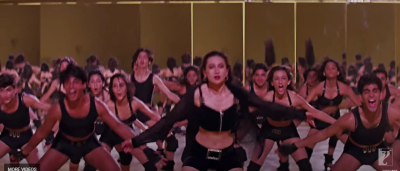 In song LE GAYI as background dancer just behind Karishma Kapoor. 
